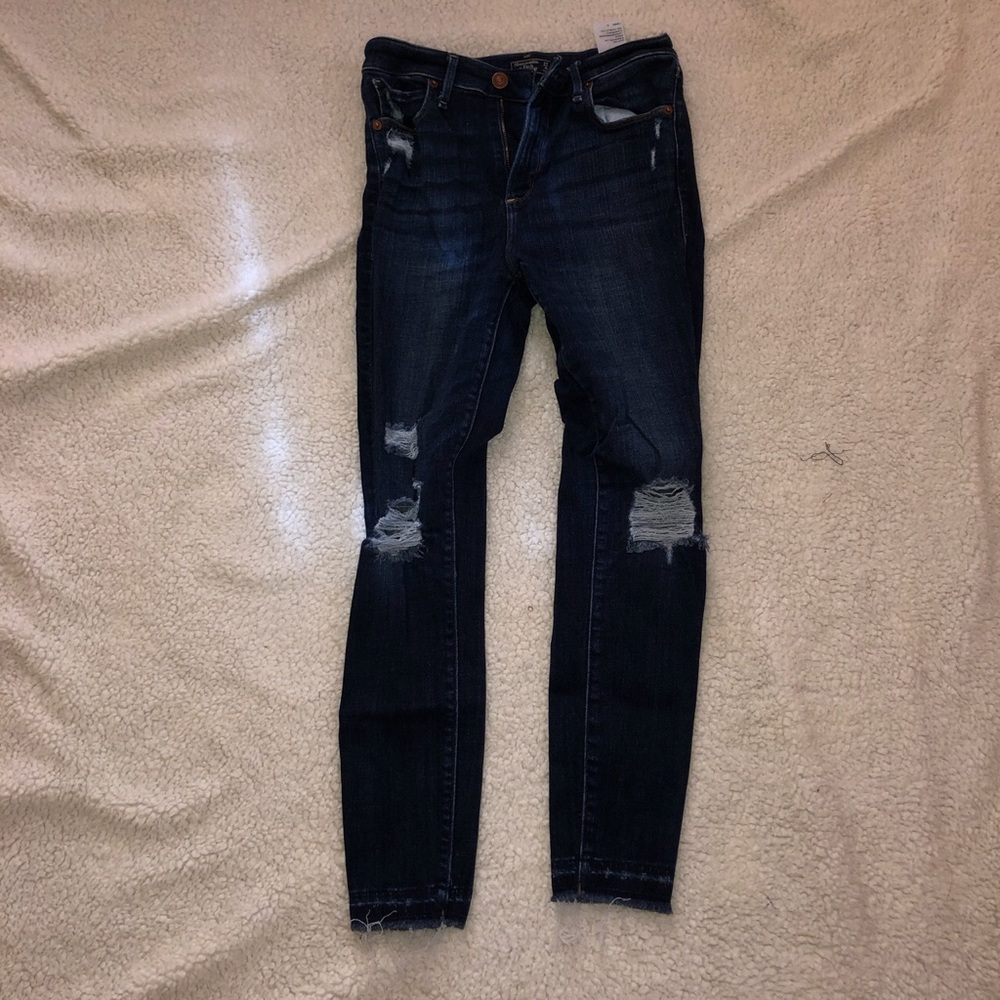 Abercrombie and Fitch ripped jeans.